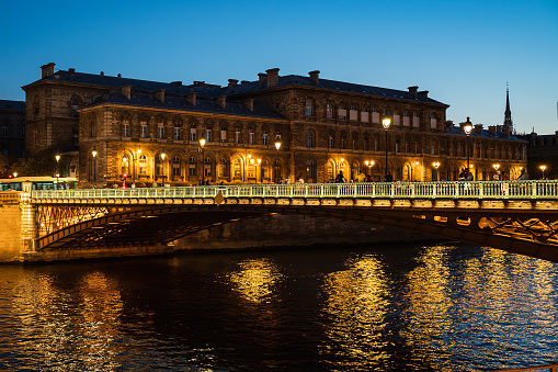 The Hotel-Dieu is a hospital located in the 4th arrondissement of Paris, on the parvis of Notre-Dame, night time lights, view at night from river Seine
