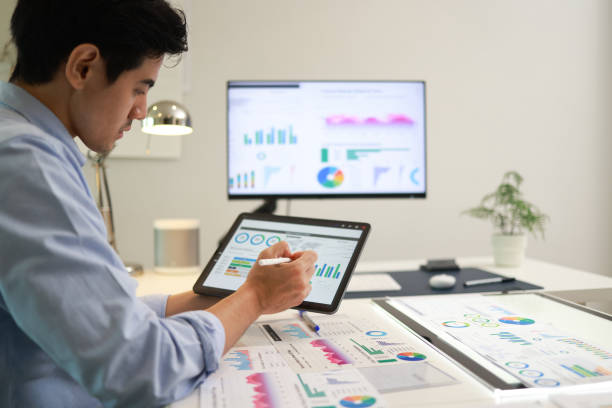 istock Business team analyzing business report and graphs with modern digital tablet. Close-up Of Businessman working with Digital Tablet 1433228534