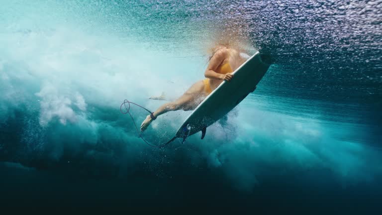 Surfer Girl Duck Dive Ocean Wave