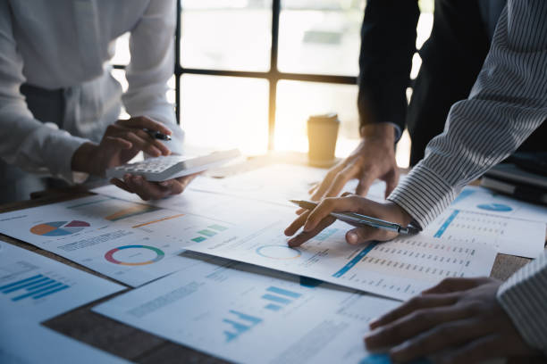 istock Business people making report, calculating using calculator and checking montly budget, Audit concept. 1433234475