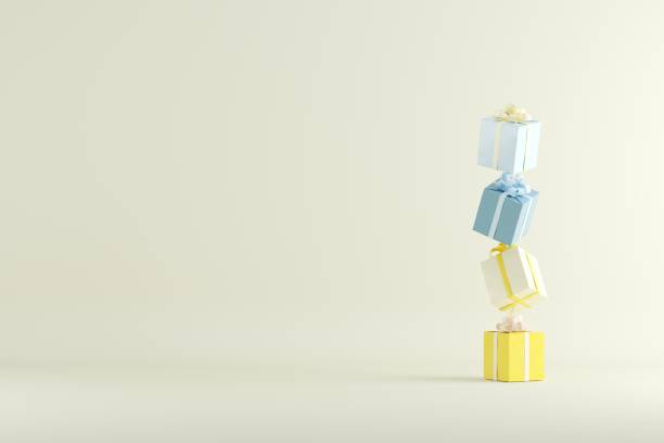 istock colorful yellow and blue gift box stacked on yellow background for copy space. 1433235478