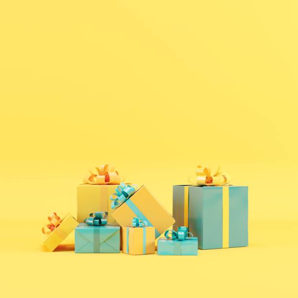 colorful Blue and yellow  gift box set on yellow background for copy space. 3D render. minimal Christmas idea concept.