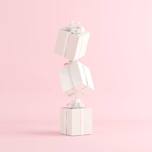 istock White gift box stacked on pink background for copy space. 3D render. minimal Christmas idea concept. 1433235599