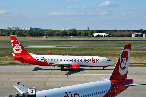 Berlin, Germany- April 23: Berlin is the capital of Germany and it has several airports. Prior to Berlin Brandenburg Airport‘s’ opening-up, Tegel Airport is a mjor hub.  Here is a Boeing 737 airplane of Air Berin taxing inTegel Airport.