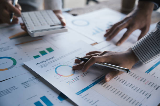 istock Business people making report, calculating using calculator and checking montly budget, Audit concept. 1433237960