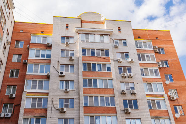 istock A typical brick multi-storey apartment building against the sky. 1433244126
