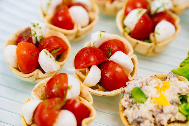 istock cherry tomatoes and mozzarella cheese in dough baskets. 1433244677
