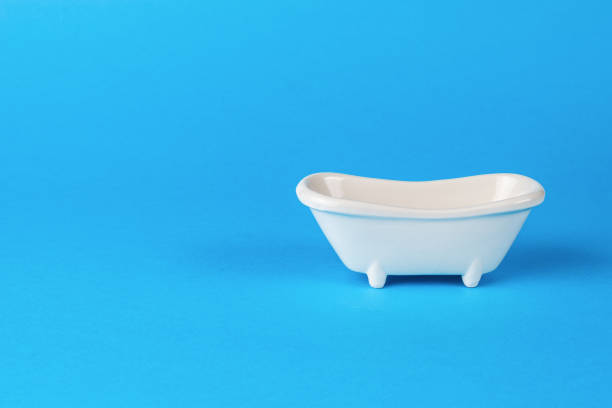 istock Classic white bathing tub on a blue background. Minimal concept. 1433249943