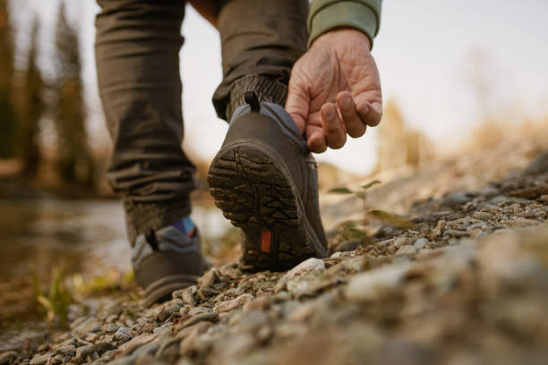 istock men's footsteps on the beach of river 1433253959