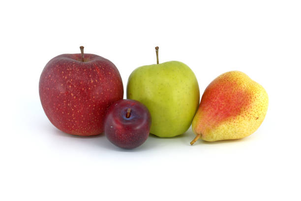 Close-up of a red pear with a measuring tape around it. Much space for copy. Shallow depth of field. Can illustrate the concept of dieting, weight loss, etc.