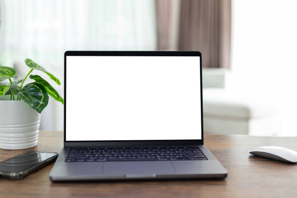istock mock up empty screen computer on wood desk in home.Notebook Laptop with blank screen 1433263639