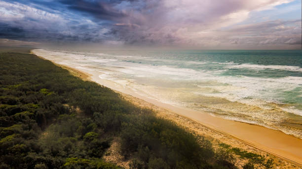 Water’s edge at the beach on Fraser Island on Queensland’s Fraser Coast.