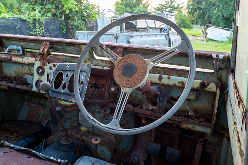 Steering wheel and a dashboard of an old car