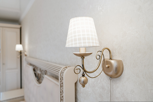 Beautiful classic sconces with a lampshade for a classic retro interior. accessories and decorative elements. sale of lighting fixtures.