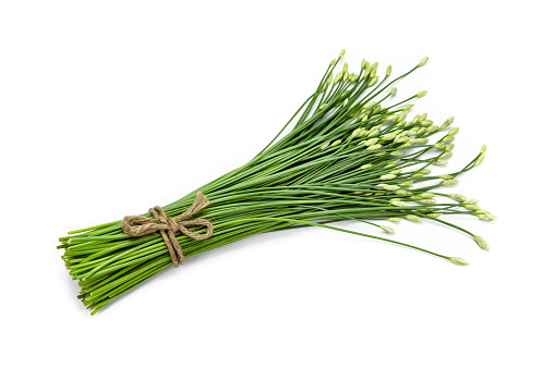 garlic chive in threshing basket isolated on white.