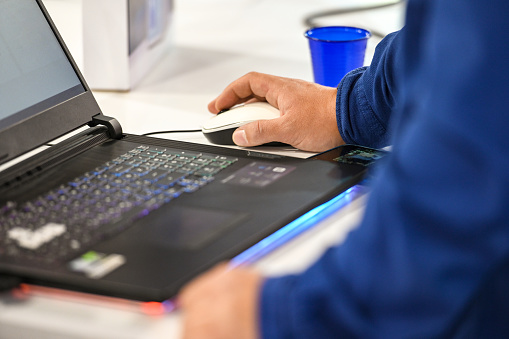 Close-up of man using laptop