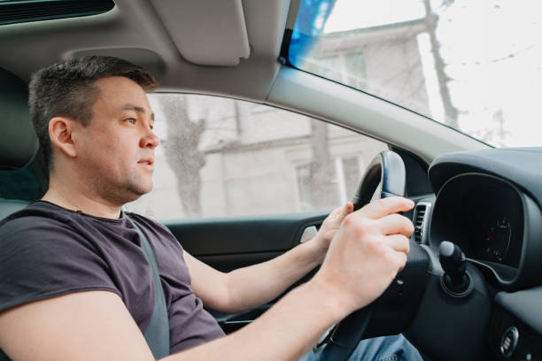 istock a man drives a car on the highway 1433272074