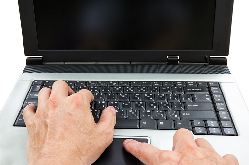 closeup man using laptop