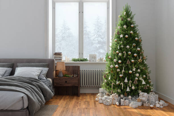 istock Modern Bedroom Interior With Christmas Tree, Gift Boxes, Messy Bed And Snowy View From The Window 1433273968
