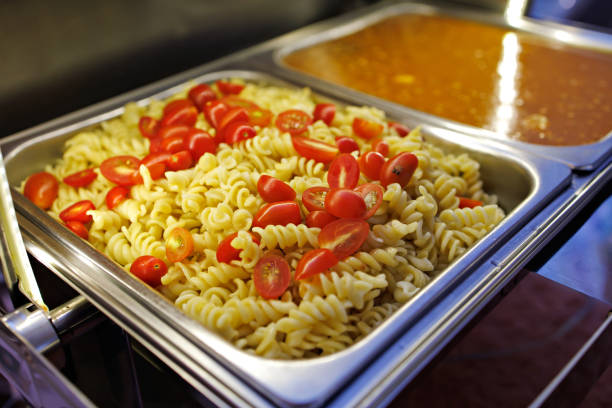 Prepared Food In Warming Dishes On Buffet, High Angle View