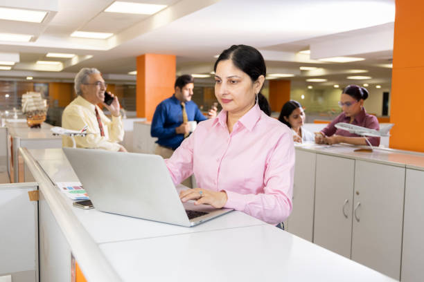 istock Happy businesswoman using laptop in office. 1433282743
