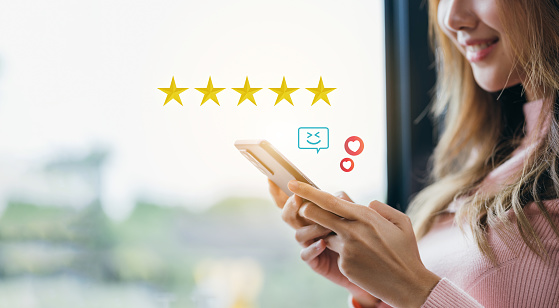 Customer satisfaction concept. businessman using a smartphone to choose 5 stars. Excellent business rating experience. Satisfaction Rating, good and impressive