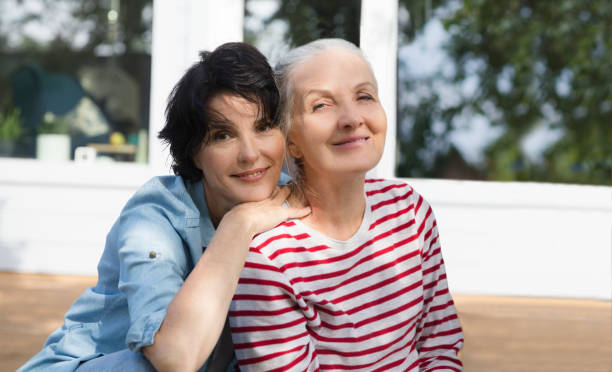 istock Two elderly women smiling and looking on camer. friendship concept 1433283053