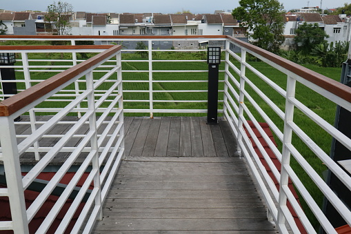 iron fence on the rooftop with white color