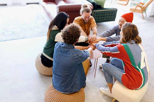 Collaboration session in office. Group of coworkers playing leisure games during team building. Group activity challenge