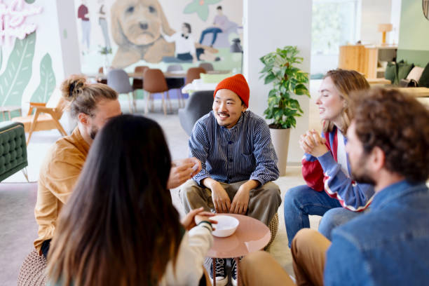 istock Group of cheerful colleagues playing charades 1433288401