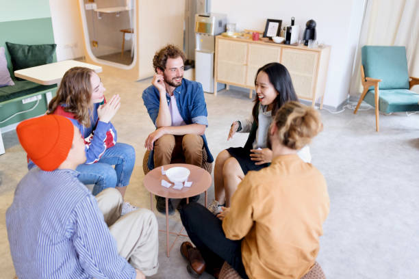istock Group of cheerful colleagues playing charades 1433288535