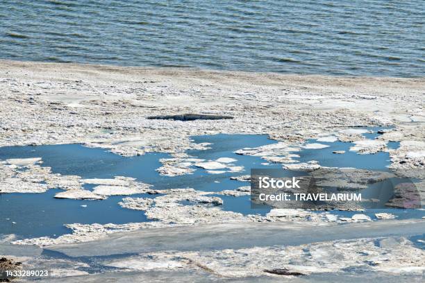 Melting Sea Ice Seasonal Natural Phenomenon Of Coming Spring Ice On Water Melts From Burning Sun Stock Photo - Download Image Now