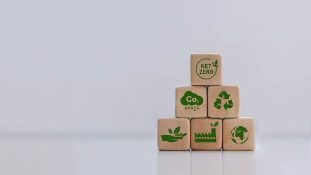 istock net zero Carbon neutral and net zero concept green net center icon on wooden block Natural environment, weather, with a rotating globe with plasticine. Greenhouse gas emissions target 1433292218