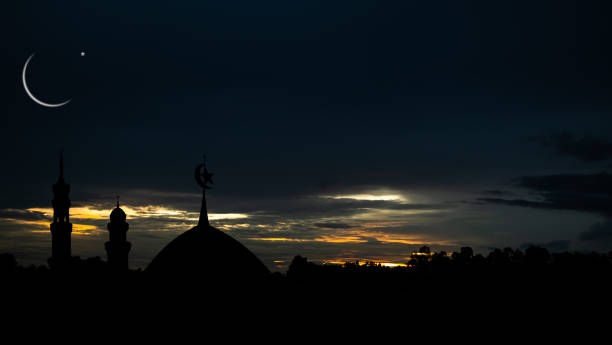 istock Mosques Dome,Crescent Moon on Sunset Twilight Sky with Shadow Leaves Background 1433292788