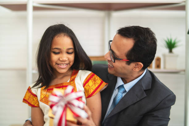 istock Daughter giving gift box to his father 1433293958