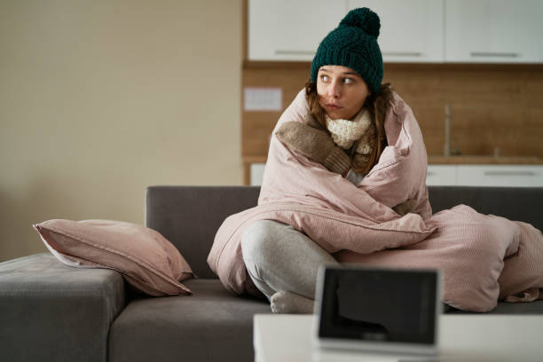 istock Caucasian woman has very low temperature at home 1433295147