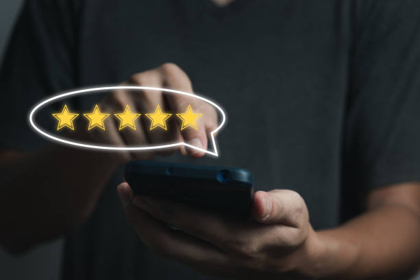 istock businessman hand using smart phone and give five star symbol icon for feedback review satisfaction service rating of product. Satisfaction Concept. 1433295286