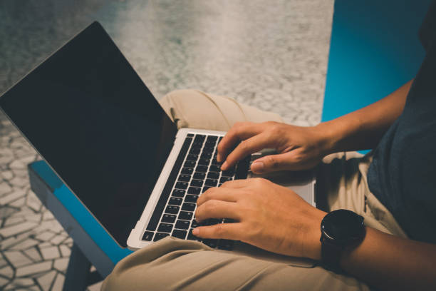 istock Man using laptop for business technology communication working, typing, and connecting to the internet while using a wireless network. 1433295433
