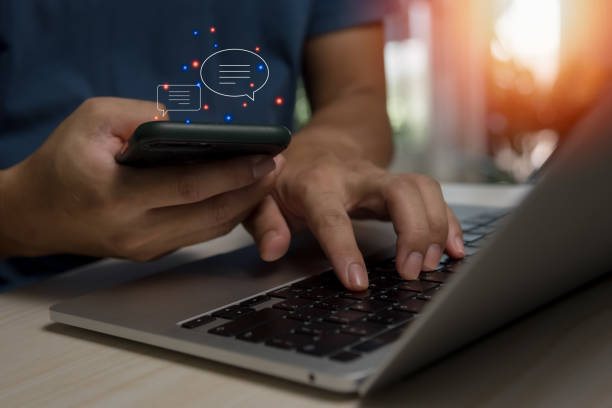 istock Men hands using mobile phone typing Live chat chatting and social network. chatting application working in chat box icons.Social media marketing technology concept. 1433295436
