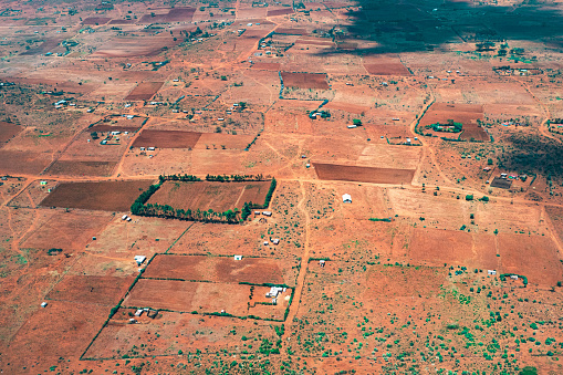 Aerial view of the Zambian city of Livingstone, showing features such as Livingstone railway station, and the Livingstone Museum (centre front), with the mist rising from Victoria Falls in the background, showing how the local name, Mosi-oa-Tunya (the Smoke that Thunders) is appropriate.