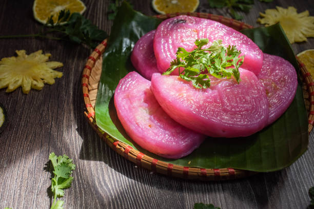 istock Willow cake ( Banh La Lieu) is a Vietnamese snack with ingredients including glutinous rice, dried shrimp, shiitake mushrooms, papaya salad and dipped with soy sauce. 1433304777