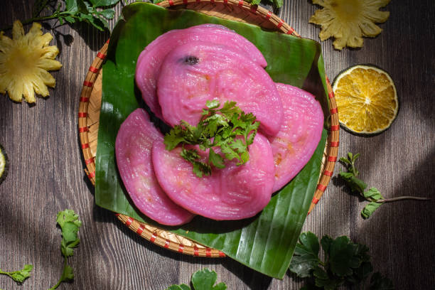 istock Willow cake ( Banh La Lieu) is a Vietnamese snack with ingredients including glutinous rice, dried shrimp, shiitake mushrooms, papaya salad and dipped with soy sauce. 1433304782