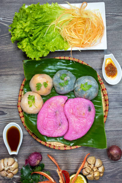 istock Willow cake ( Banh La Lieu) is a Vietnamese snack with ingredients including glutinous rice, dried shrimp, shiitake mushrooms, papaya salad and dipped with soy sauce. 1433304840