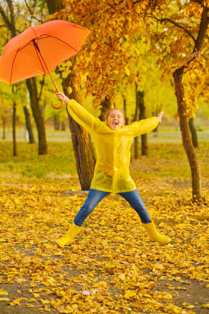 istock happy kid in autumn park 1433305439