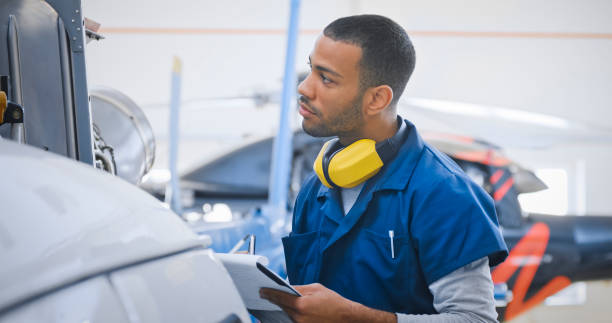 istock Male mechanic checking helicopter 1433312479