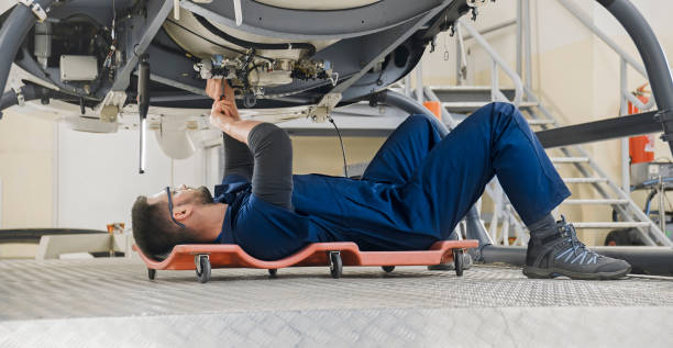 istock Mechanic repairing helicopter engine 1433312522
