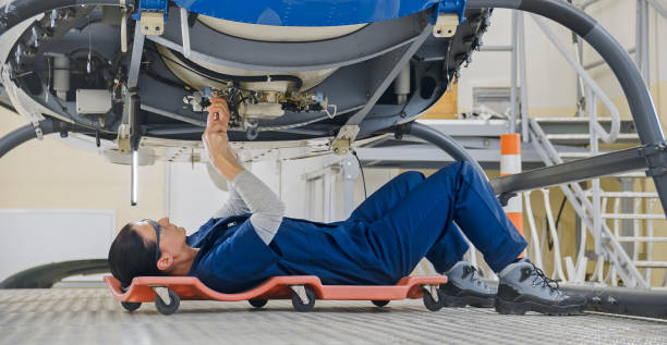 istock Mechanic repairing helicopter engine 1433312531