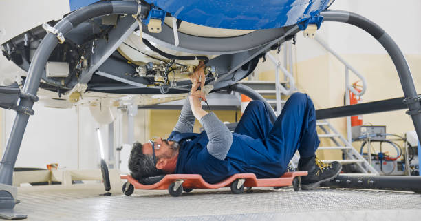 istock Mechanic repairing helicopter engine 1433312534