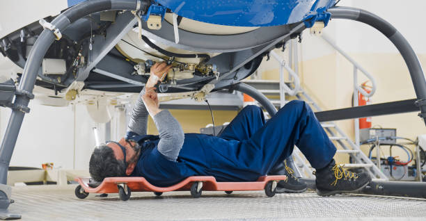 istock Mechanic repairing helicopter engine 1433312536