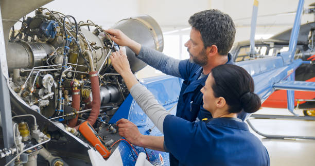 istock Mechanics repairing helicopter engine 1433312541